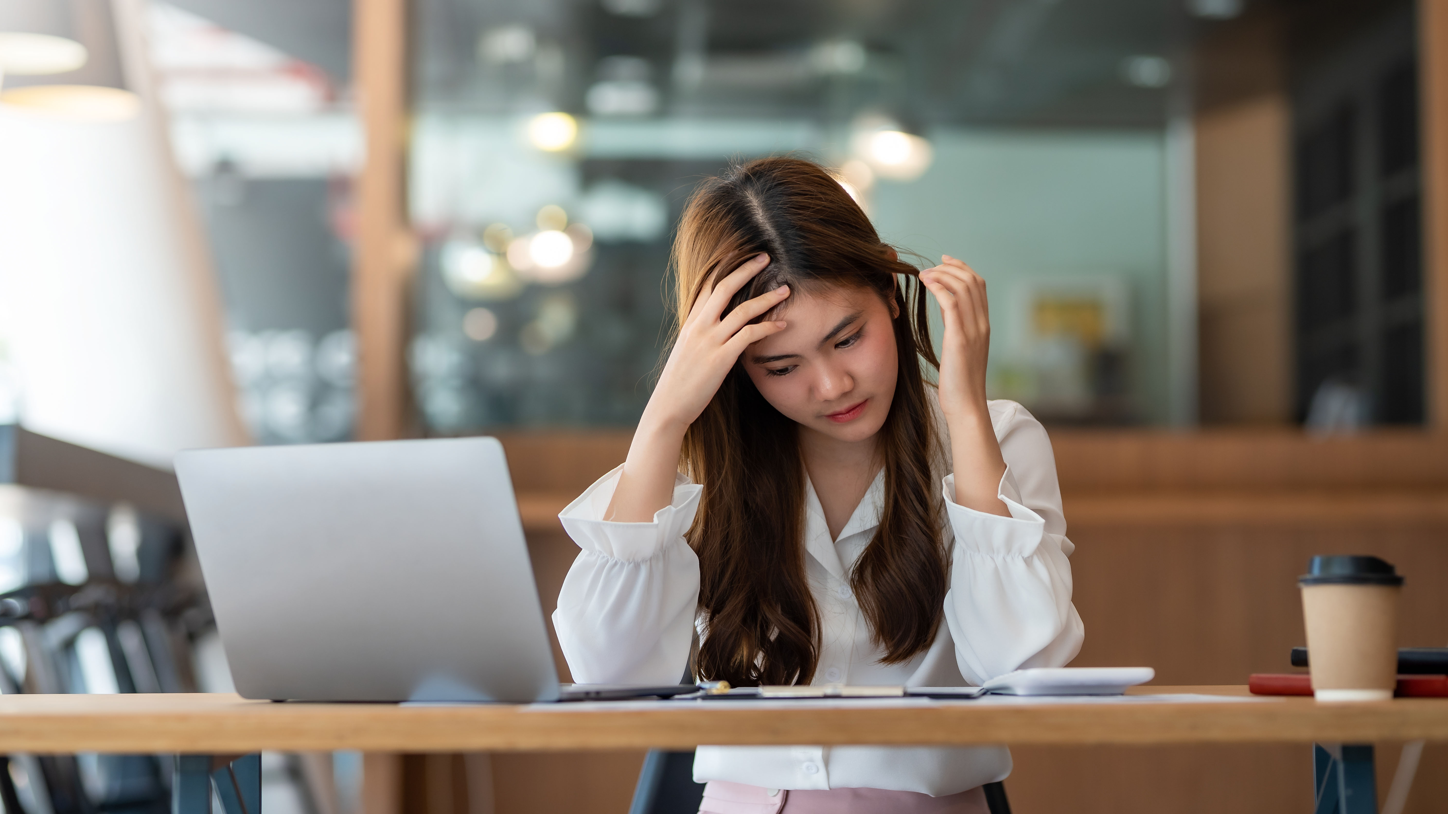 Asian Businesswoman Who Is Tired And Overthinking From Working W